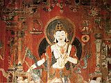 Tibet Guge 03 Tholing 08 White Temple 03 Padmapani On the left wall is a painting of Padmapani (Lotus-Bearer), one of oldest forms of Avalokiteshvara, the Bodhisattva of Infinite Compassion. The right hand makes the gesture of giving while the left signifies teaching. Padmapani is identified by the lotus flower above his left shoulder, with the stem held in his left hand. Photo - Hein/Boelmann: Tibet � Der Wei�e Tempel von Tholing.